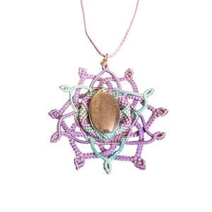 Handmade mandala necklace with a large stone.